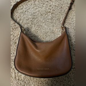 Michael Kors Purse! Little spots on the outside from light use.